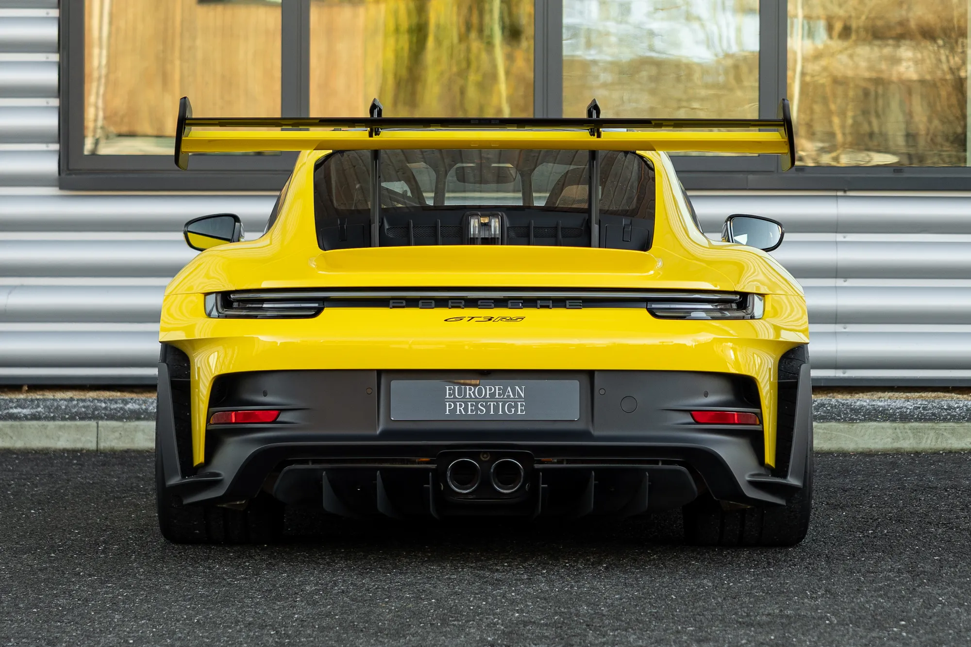Yellow Porsche 911 GT3 RS rear view with custom number plate